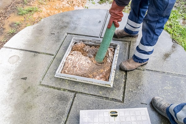 cesspool pumping requires specialized vacuum trucks and hoses to extract and dispose of the waste